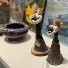 two female figurines made of clay and a clay bowl