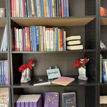black Bookshelf displaying four shelves of spiritual growth books