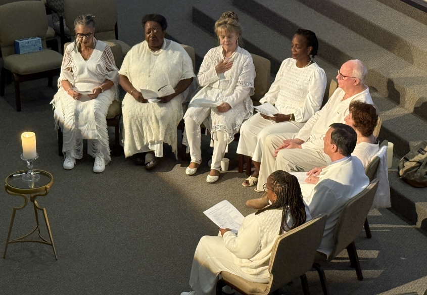 seven prayer chaplains dressed in white sitting in a prayer circle. world day of prayer 2025, unity of the triangle