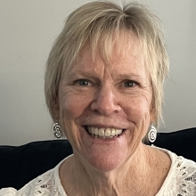 IMG_1162 Jeanne Evans wearing off white blouse smiling