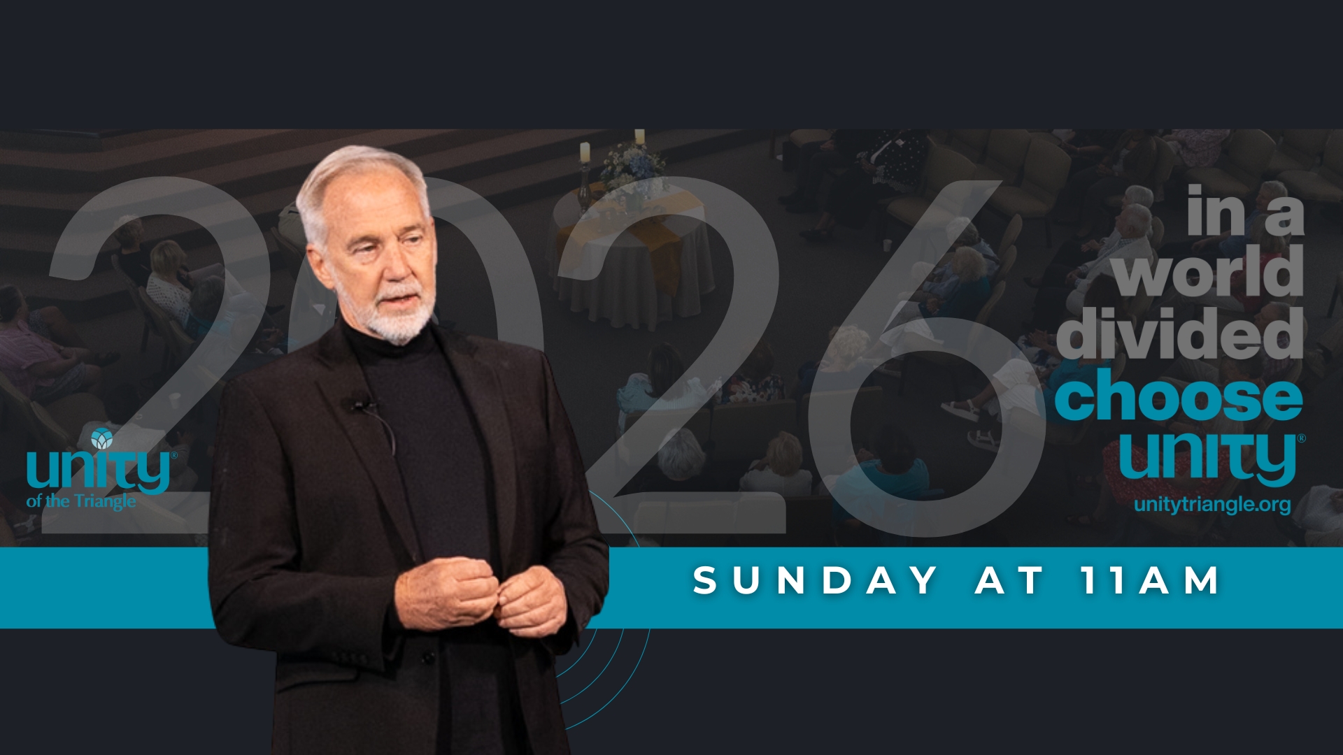 2026 theme at Unity of the Triangle is "In A World Divided, Choose Unity." Rev. Neusom Holmes pictured wearing black turtleneck and black sportcoat