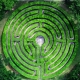 a bright green labyrinth in nature to represent dharma and meaning in everyday life