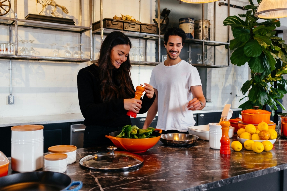 young couple cooking healthy food as part of holistic health
